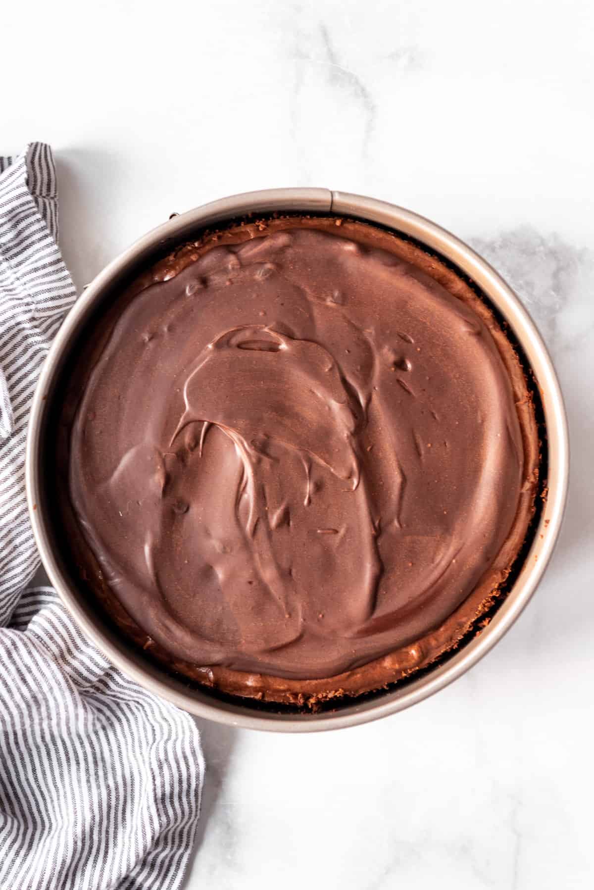 Chocolate cheesecake with the ganache layer spread over the top.