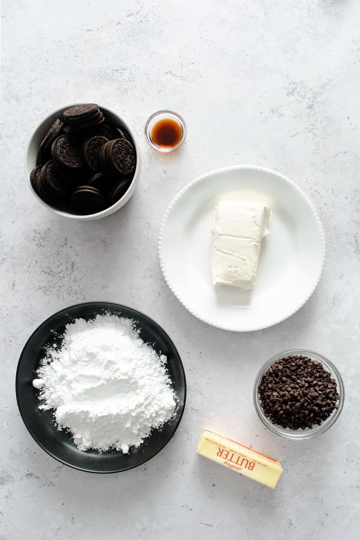 Ingredients for making a cookies & cream dessert cheese ball.