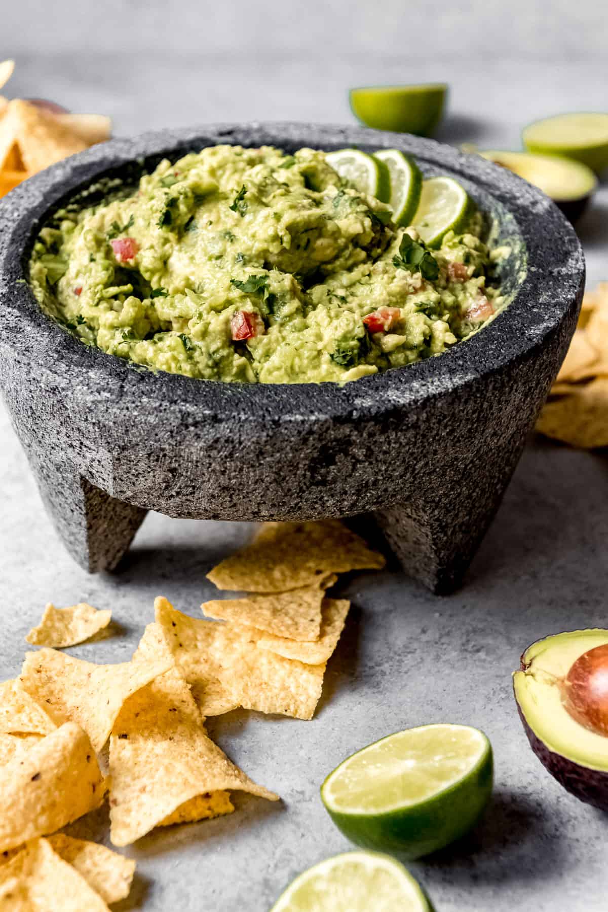 An image of authentic guacamole in a molcajete.