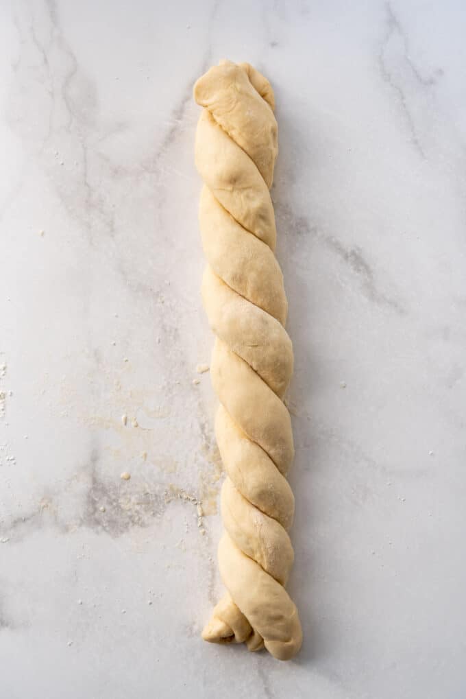 Two rolls of brioche dough twisted into a rope.