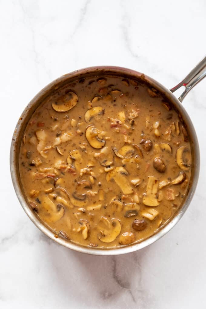 Homemade brown mushroom gravy in a pan.