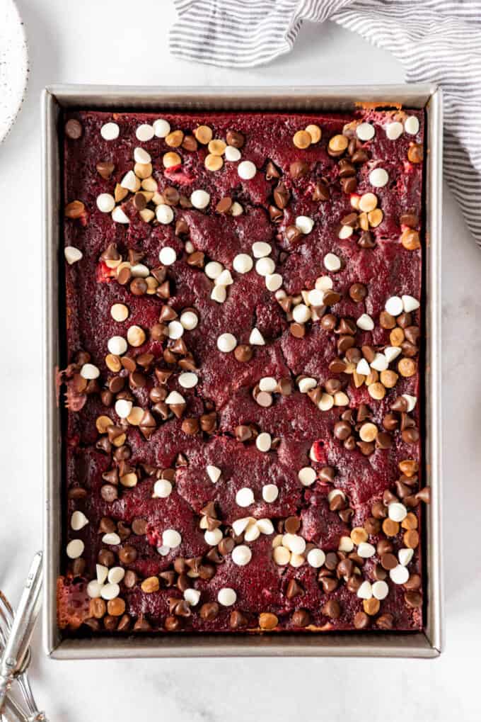 Baked red velvet earthquake cake topped with semisweet and white chocolate chips.