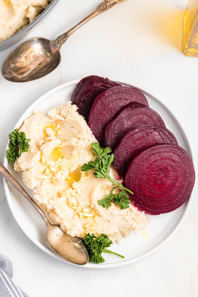 A plate with roasted beets and Greek skordalia (garlic potato dip).
