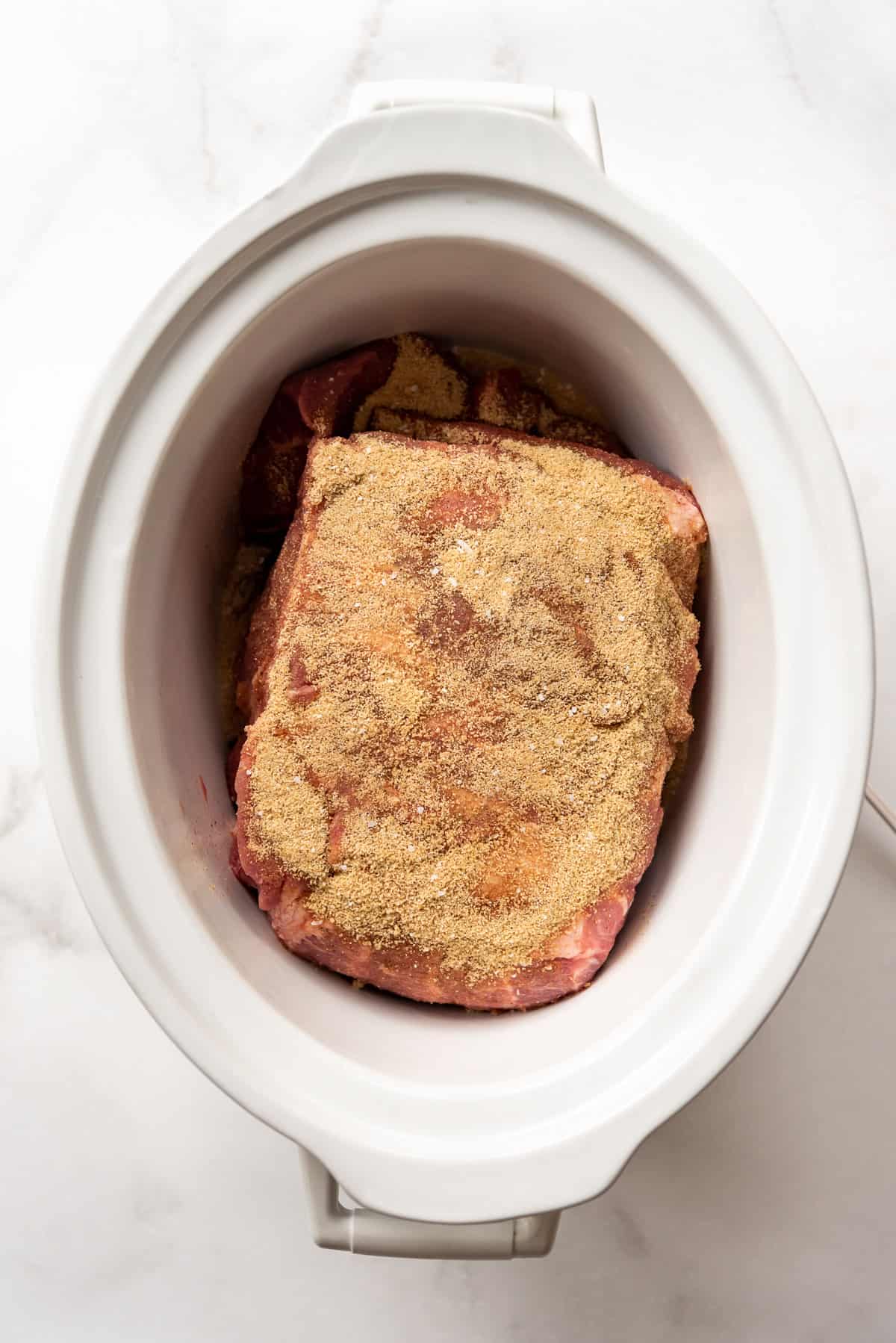 A pork shoulder rubbed with a brown sugar spice blend.