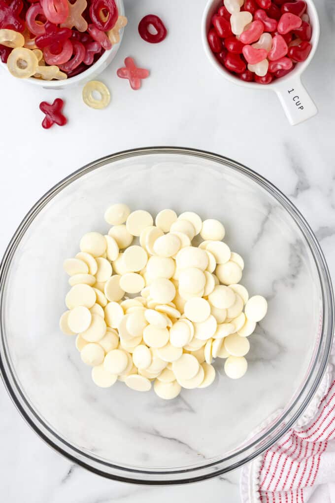 White candy melts in a large glass bowl.