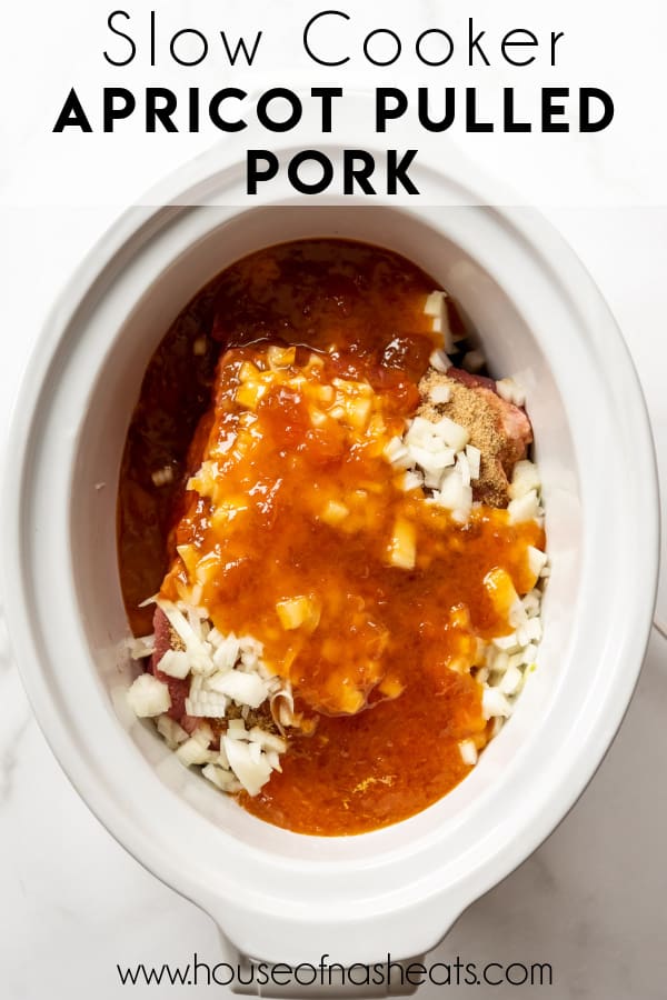 An overhead image of pork shoulder in a crockpot with apricot preserves.