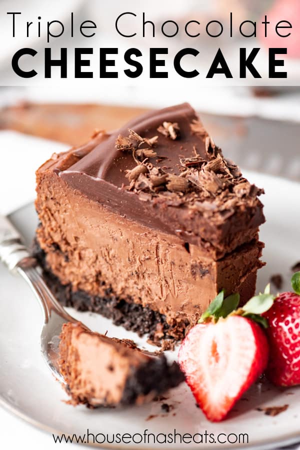 A slice of chocolate cheesecake on a plate with a bite on a fork, strawberries, and text overlay.