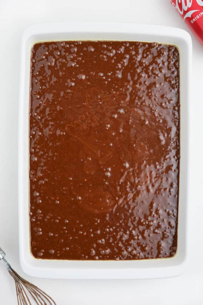 Chocolate coca cola cake batter in a large baking dish.