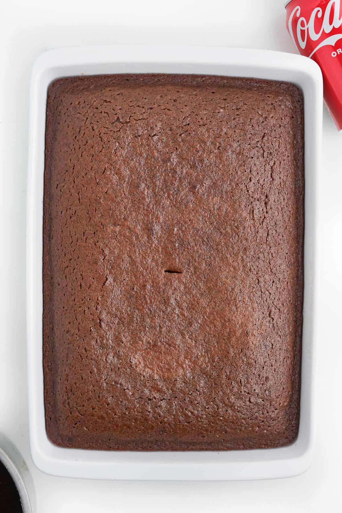 An unfrosted baked coca cola cake.