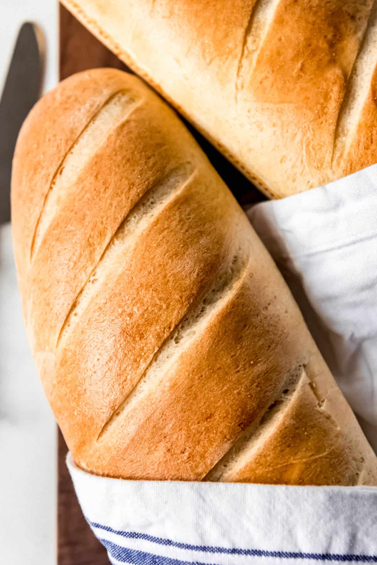 A golden brown crusty loaf of French bread.