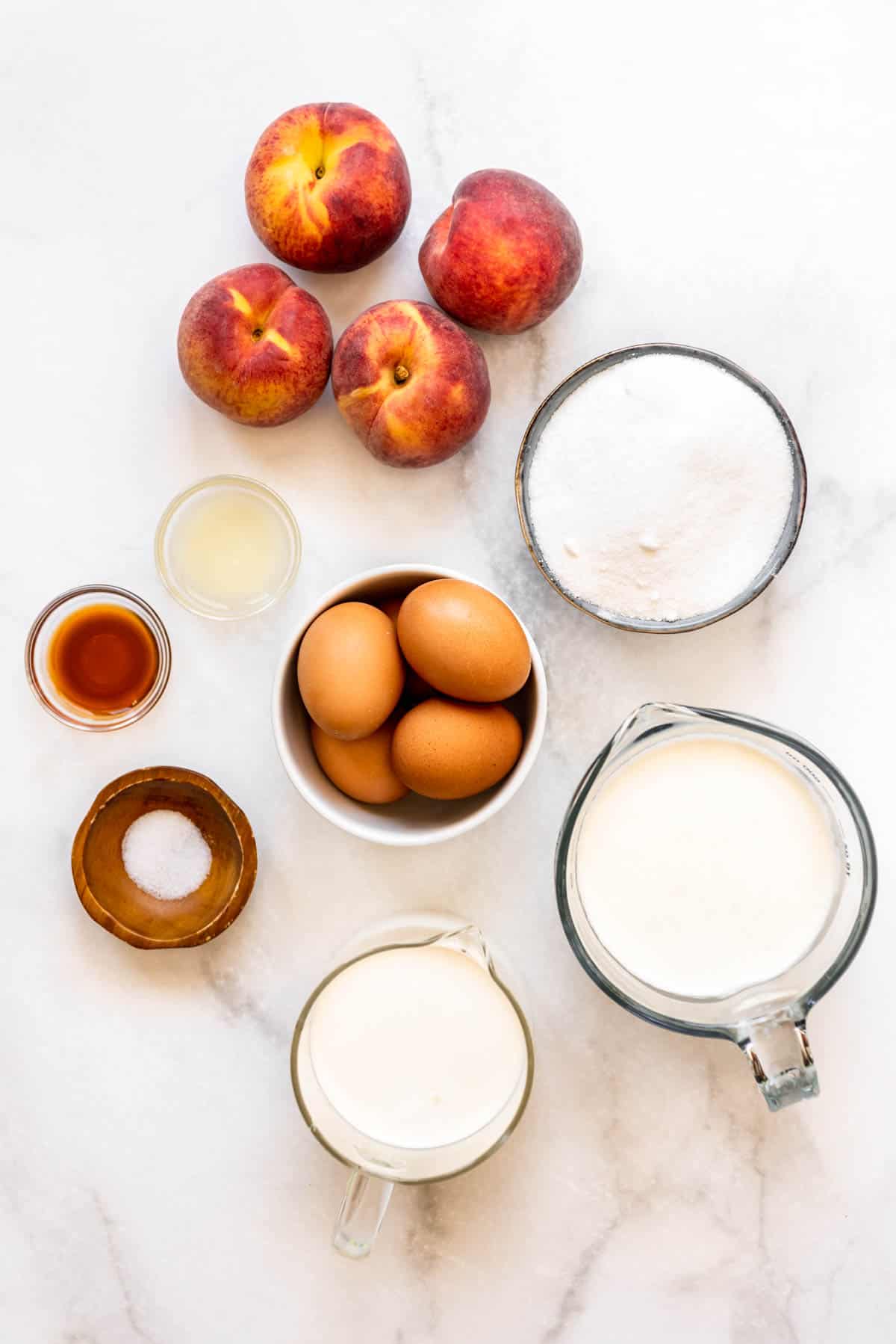 Ingredients for making homemade peach ice cream.