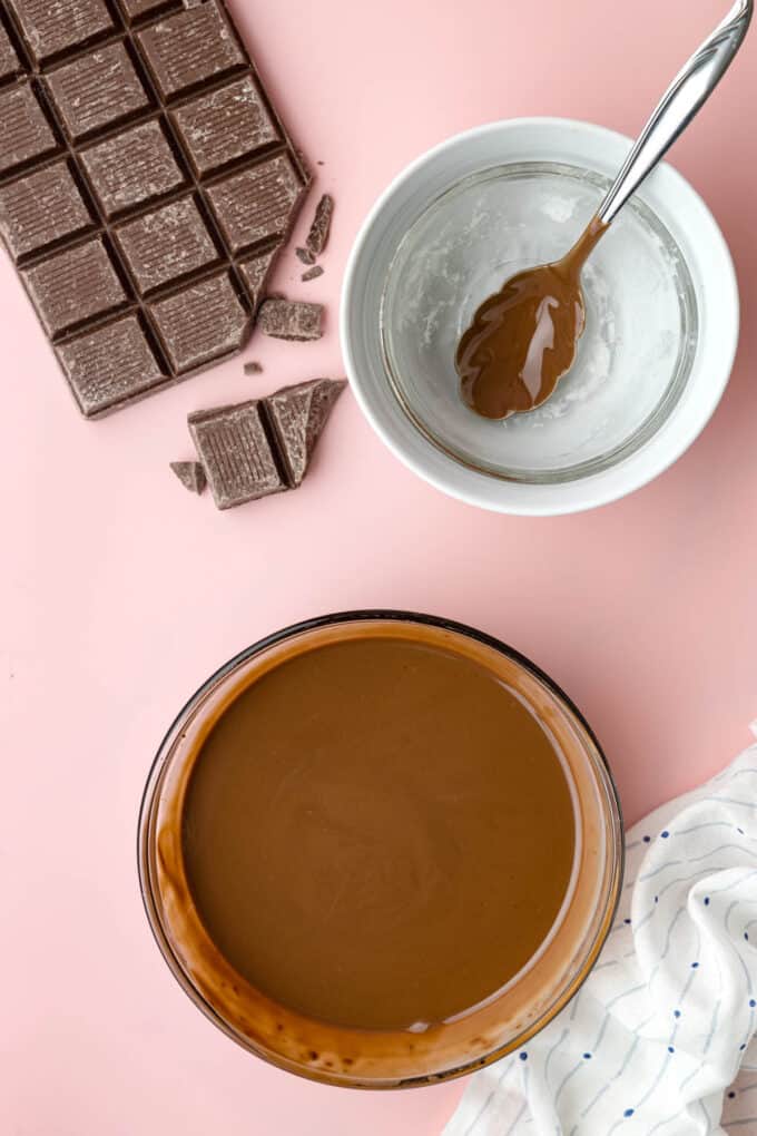 Stirring melted chocolate and coconut oil together to make homemade magic shell.