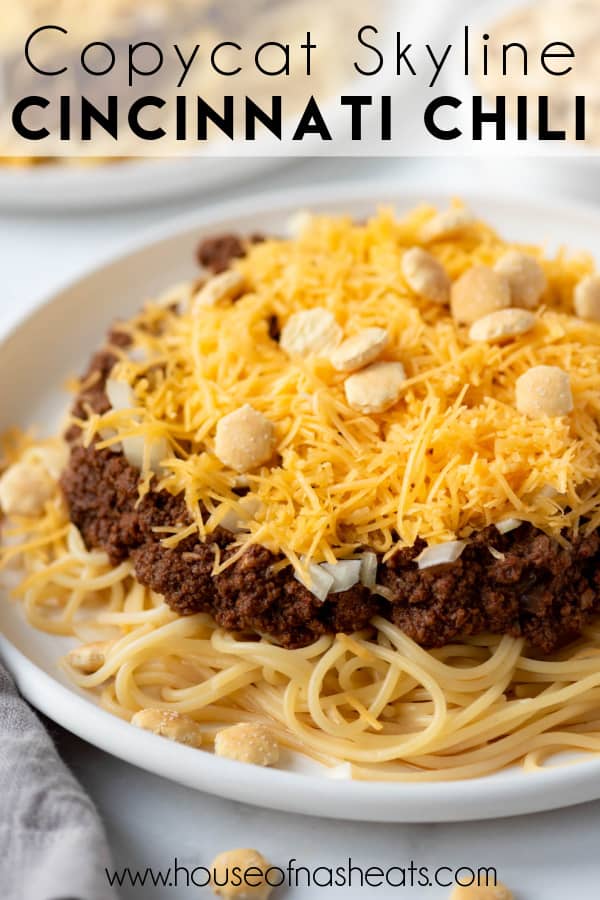 A plate of Cincinnati chili with text overlay.