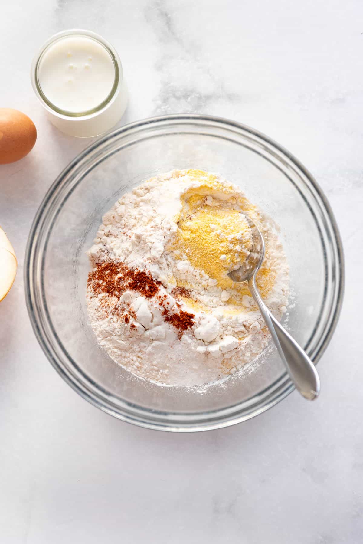 Combining dry ingredients in a bowl.