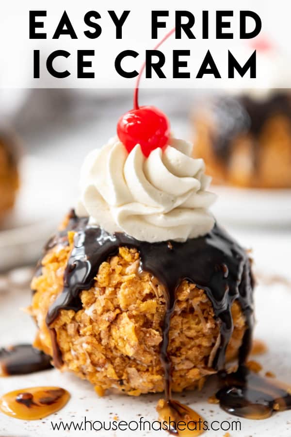 Fried ice cream topped with chocolate syrup, whipped cream, and a cherry with text overlay.