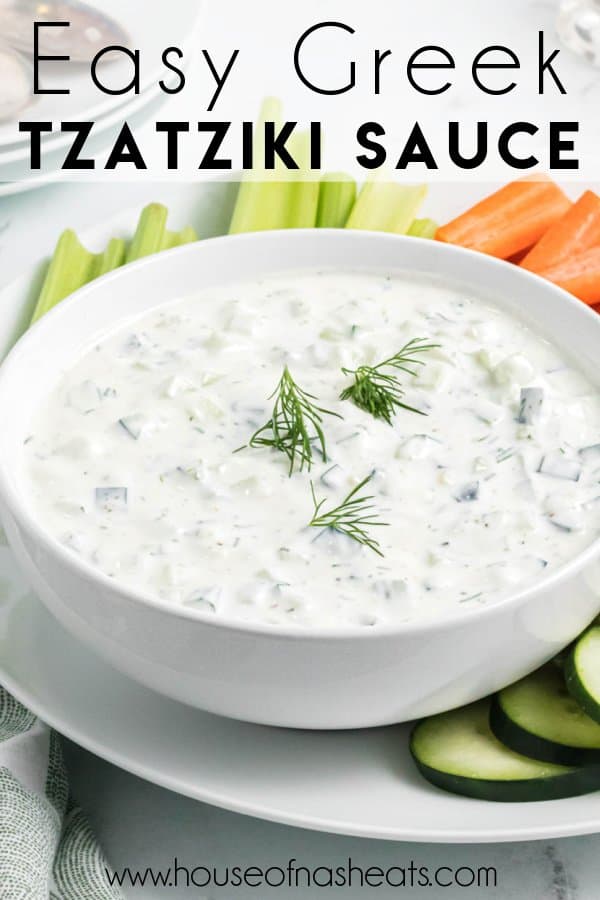 A bowl of Greek tzatziki sauce on a platter with vegetables with text overlay.