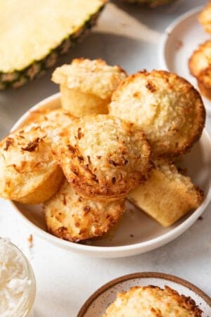 A bowl full of homemade pineapple coconut muffins.