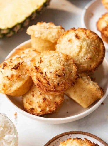 A bowl full of homemade pineapple coconut muffins.