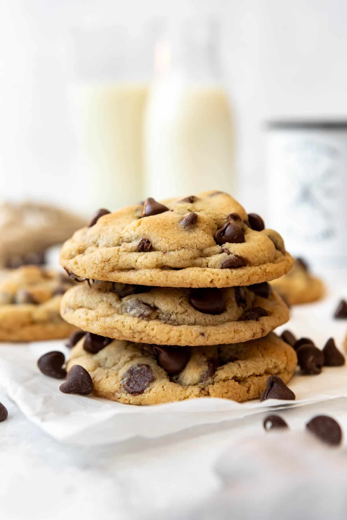 A stack of three chocolate chip cookies.