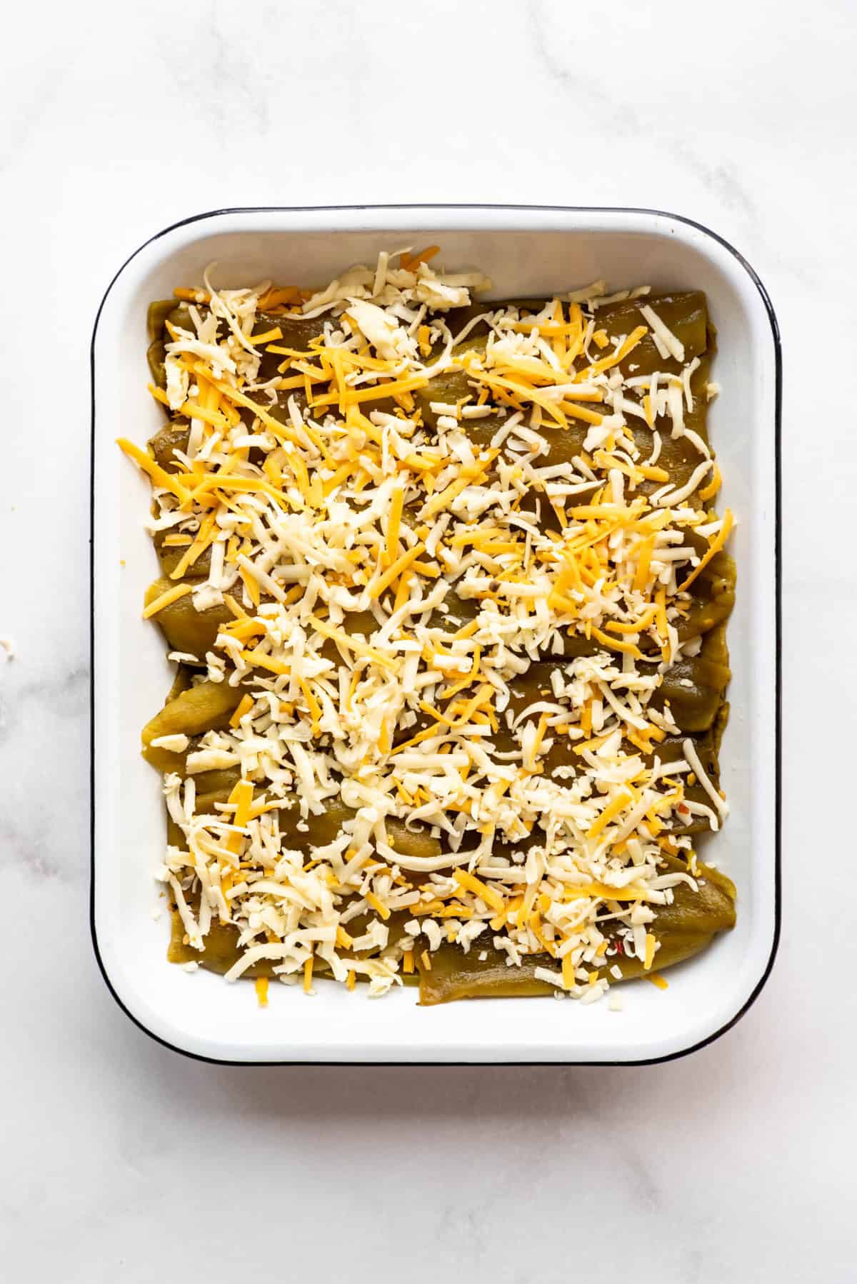 Repeating a layer of cheese to make a chile rellenos casserole.