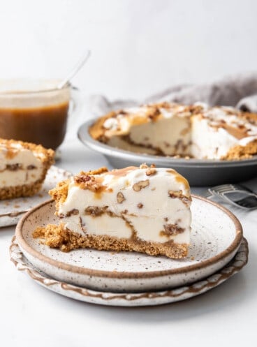 A slice of butter pecan ice cream pie with a butterscotch swirl.
