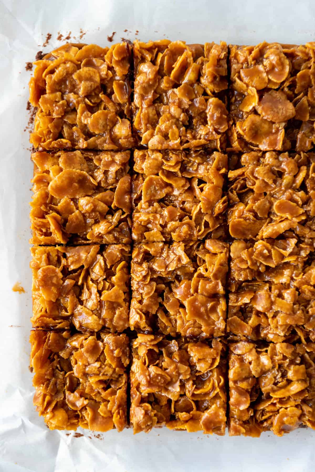 Rows of caramel cornflake brownies cut into squares.