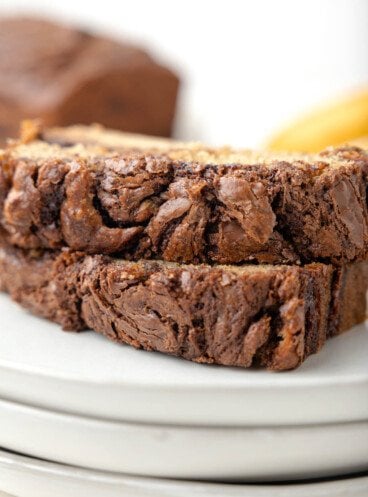 A close-up image of swirls of Nutella in banana bread slices.