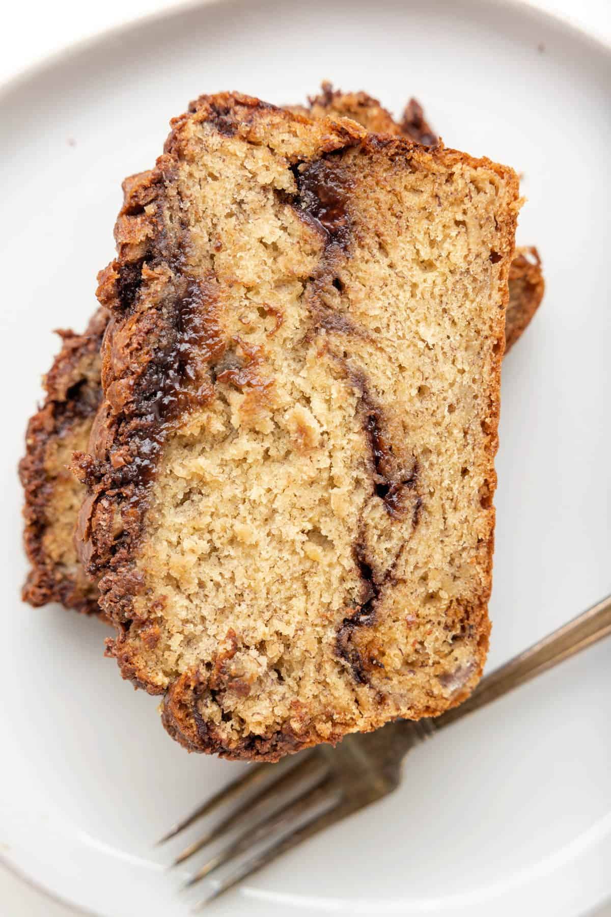An overhead image of banana bread with a Nutella swirl.