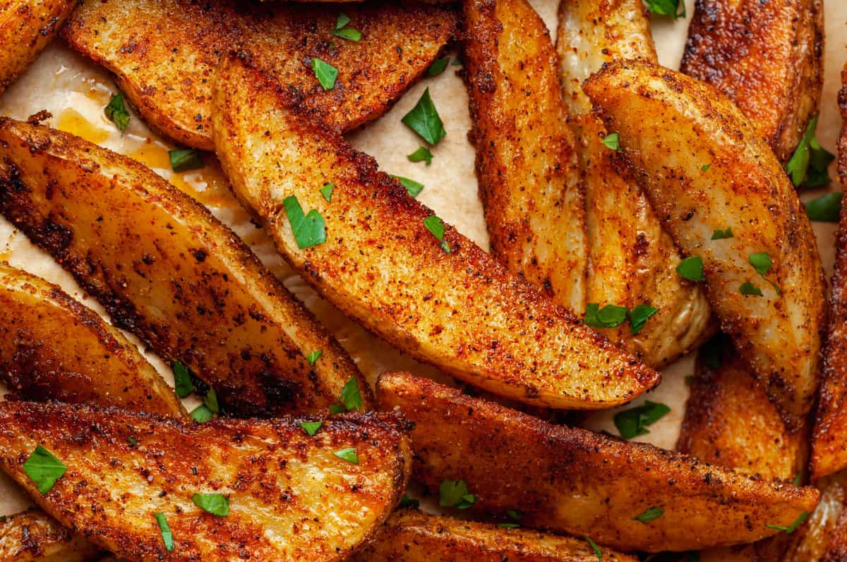 Closeup of baked potato wedges with BBQ seasoning