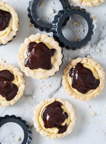 Crumbl copycat Boston cream pie cookies with chocolate glaze.
