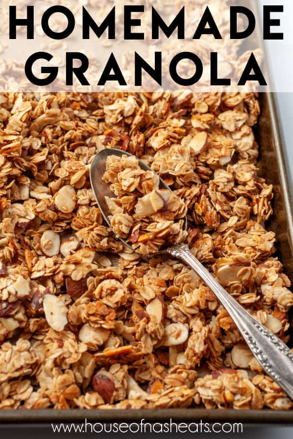 A baking sheet covered in homemade granola clumps with a spoon and text overlay.