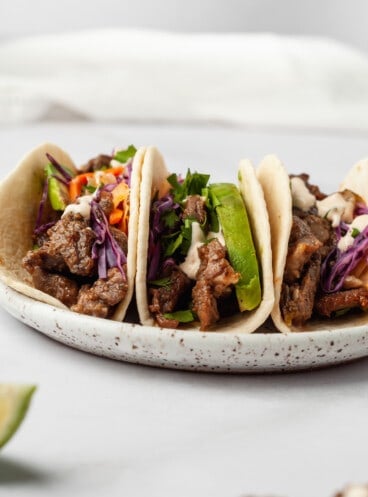 3 Korean beef tacos on plate