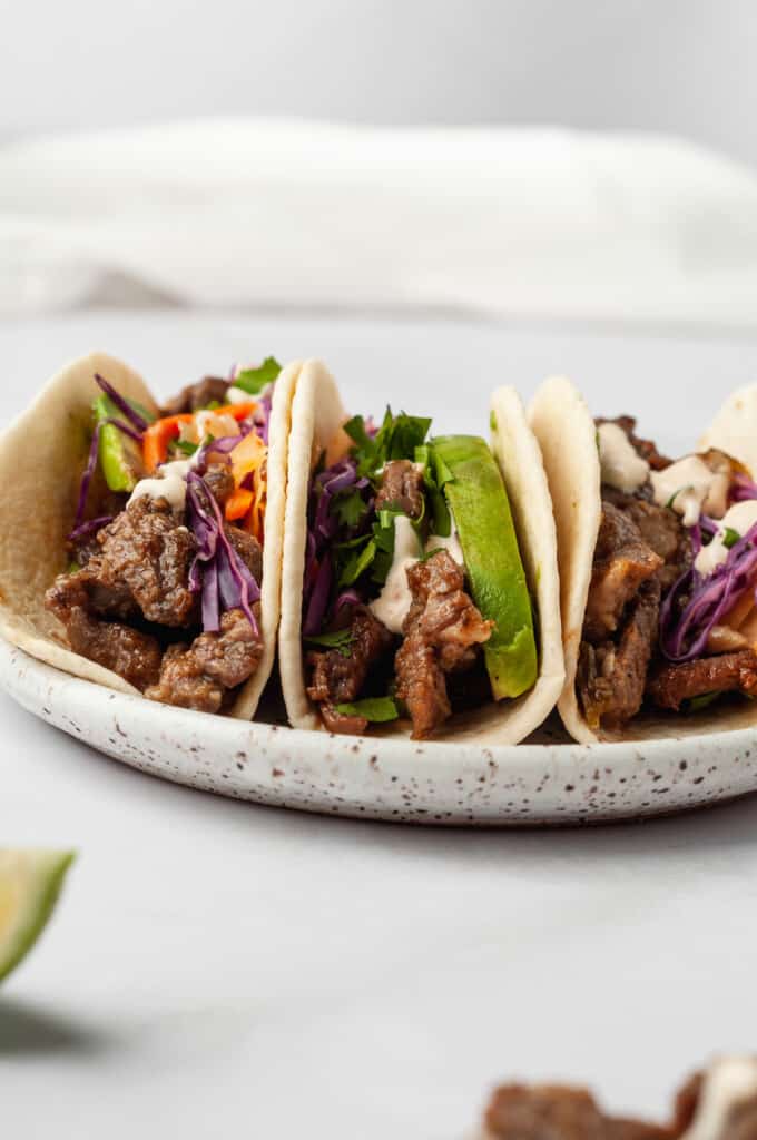 3 Korean beef tacos on plate
