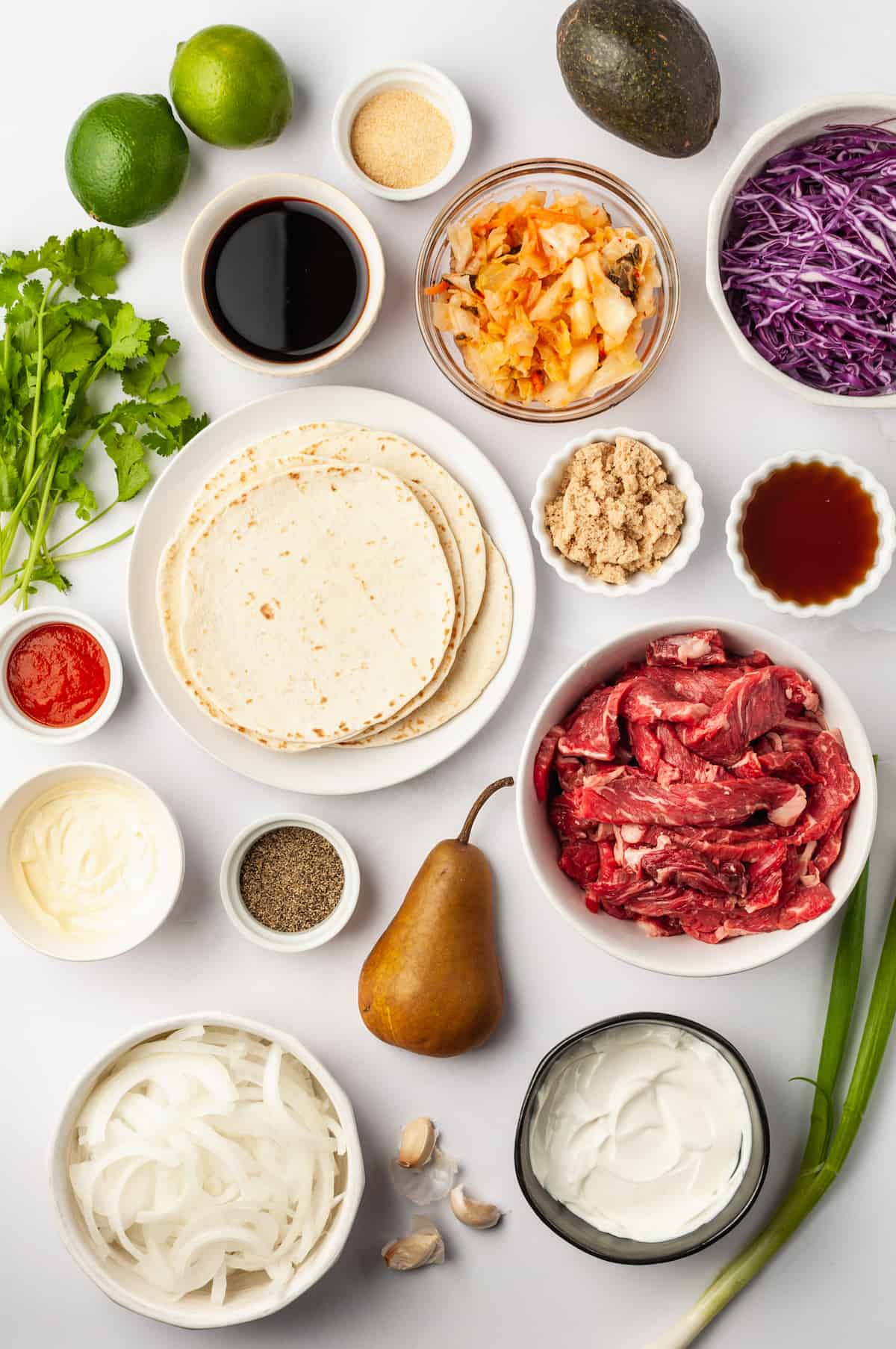 Overhead view of ingredients for Korean beef tacos