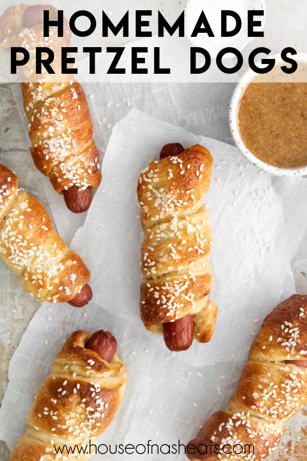 Homemade soft pretzel dogs on parchment paper with text overlay.