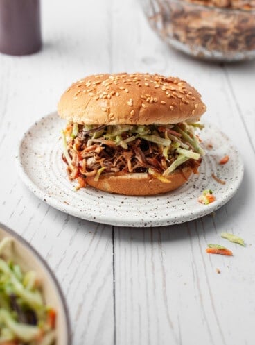 Pulled pork sandwich on plate with coleslaw