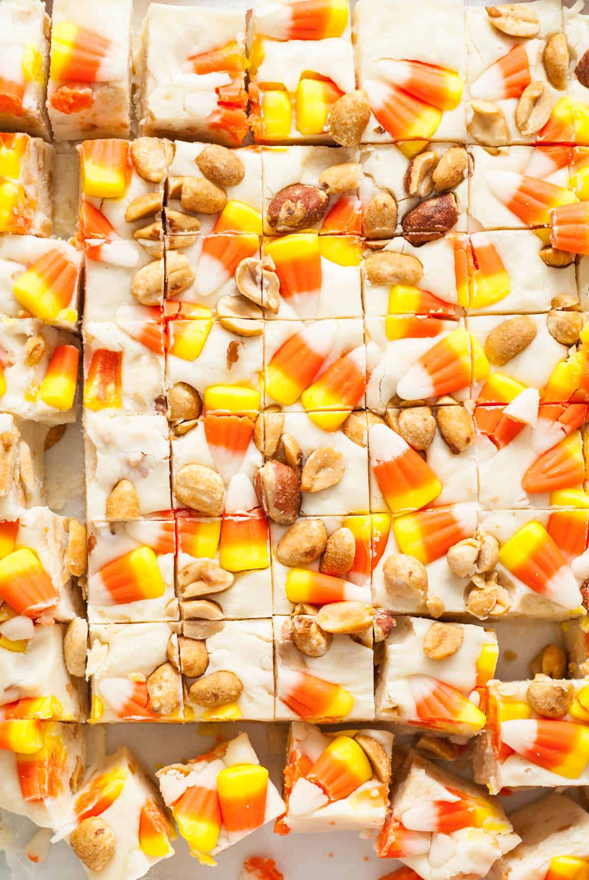 A close image of squares of Halloween candy corn & peanut fudge.