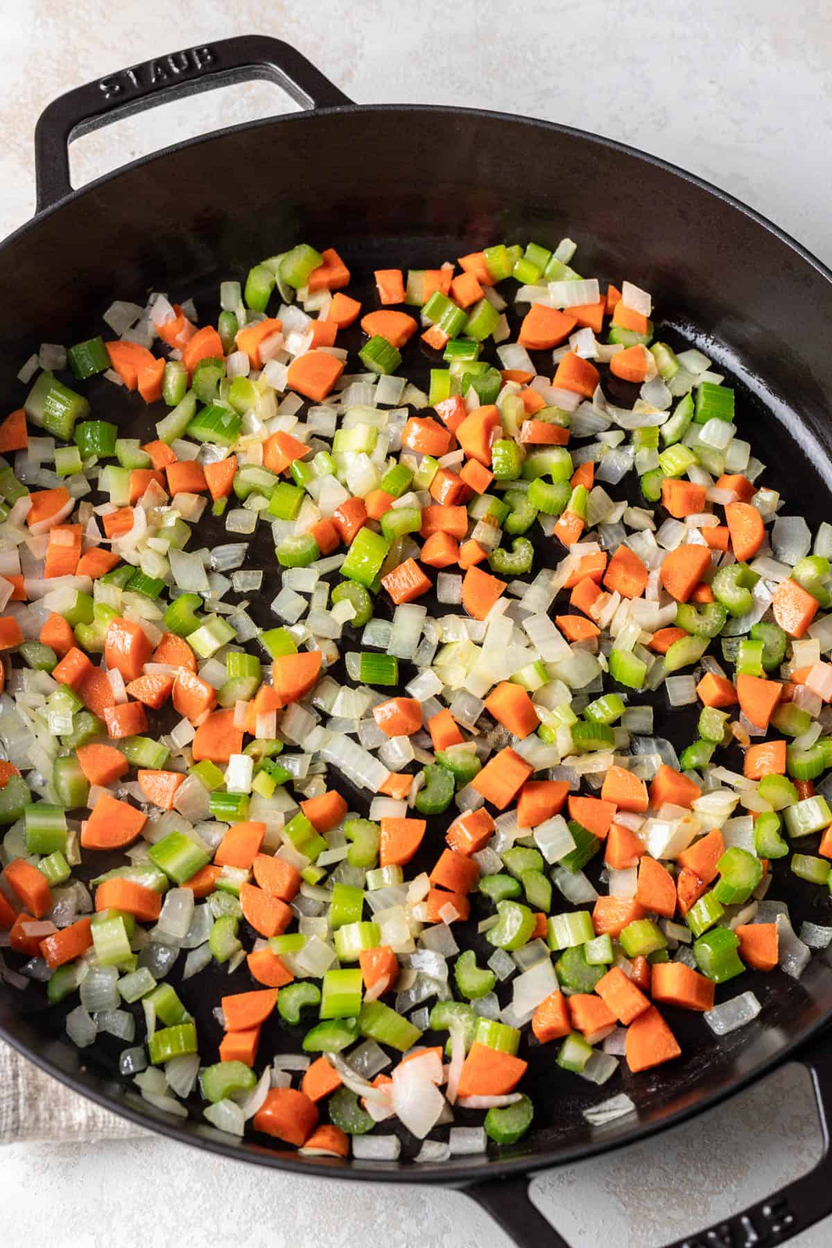 Chopped carrots, onions, and celery in a large skillet.