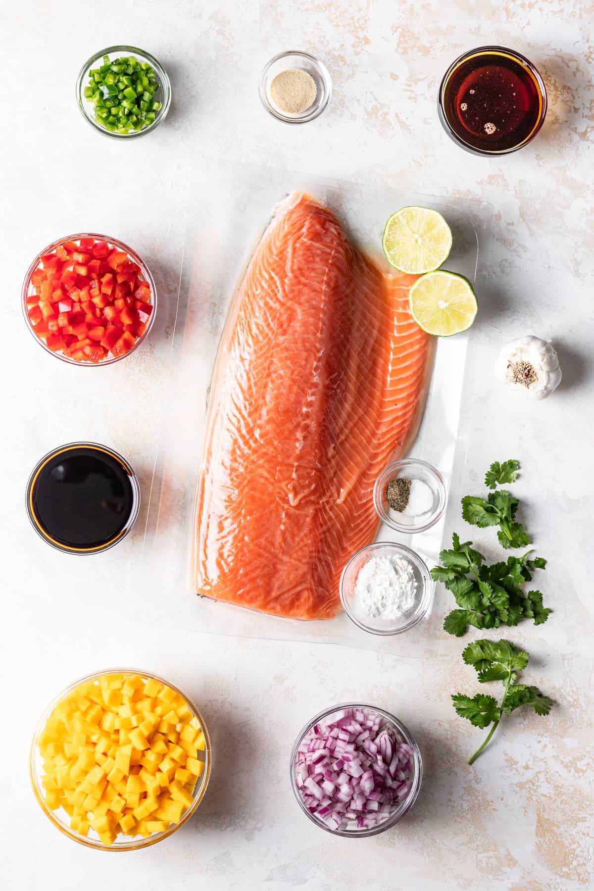 Ingredients for making baked salmon with mango salsa.