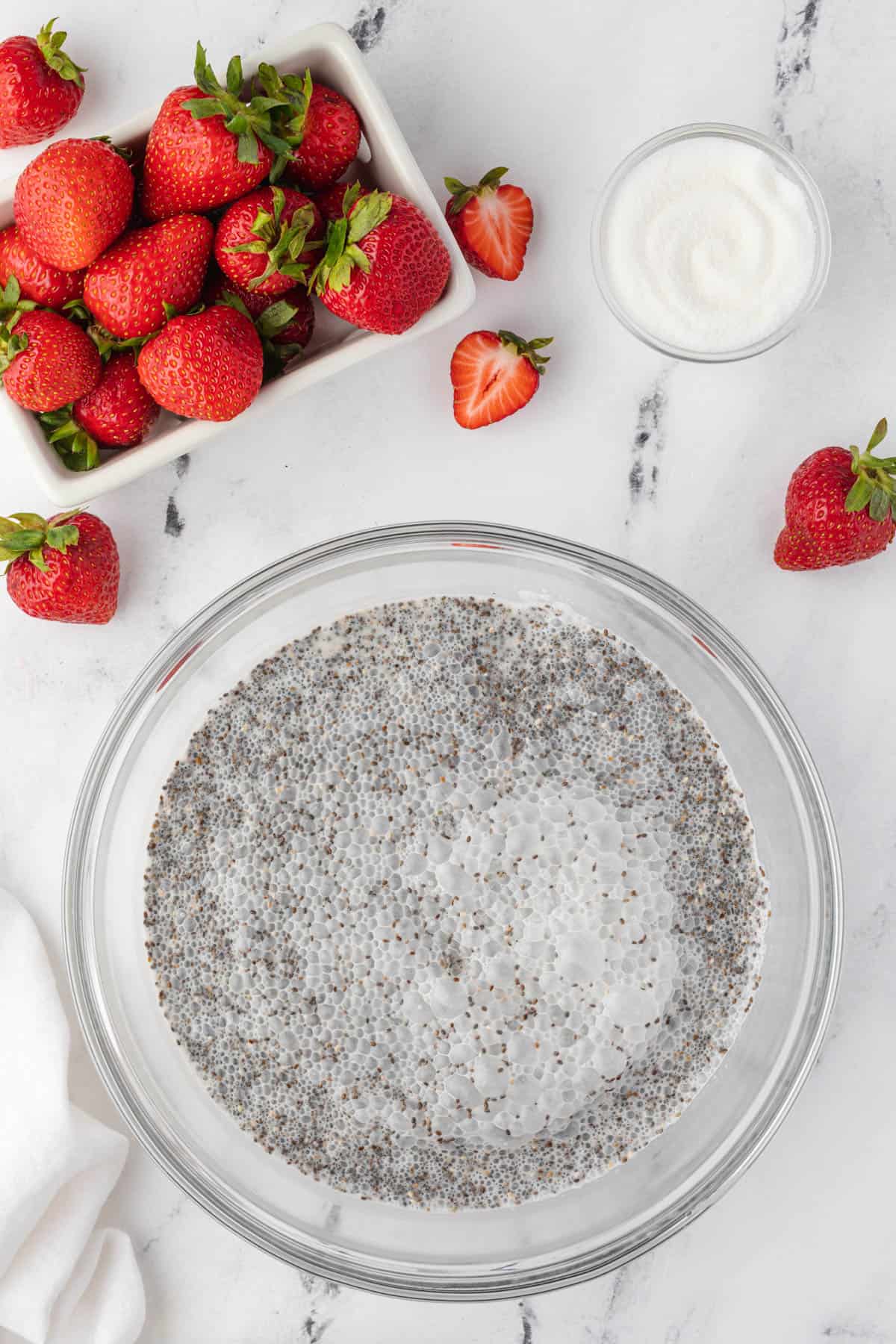 Coconut chia pudding in a bowl before all of the liquid has been absorbed.