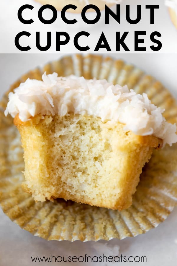 A moist coconut cupcake with a bite taken out of it lying on it's wrapper with text overlay.