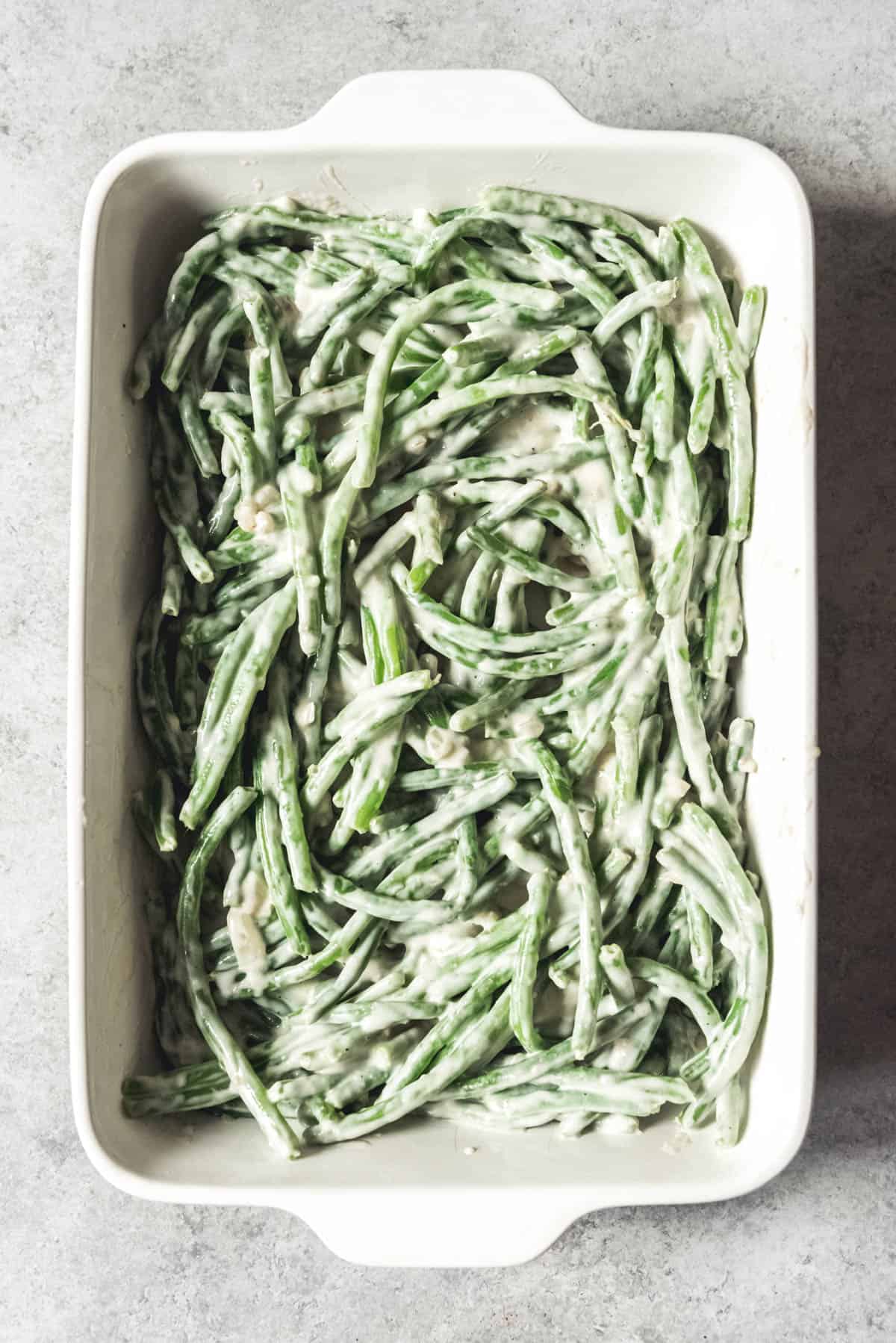An image of make-ahead green bean casserole before adding the breadcrumbs and fried onions on top.