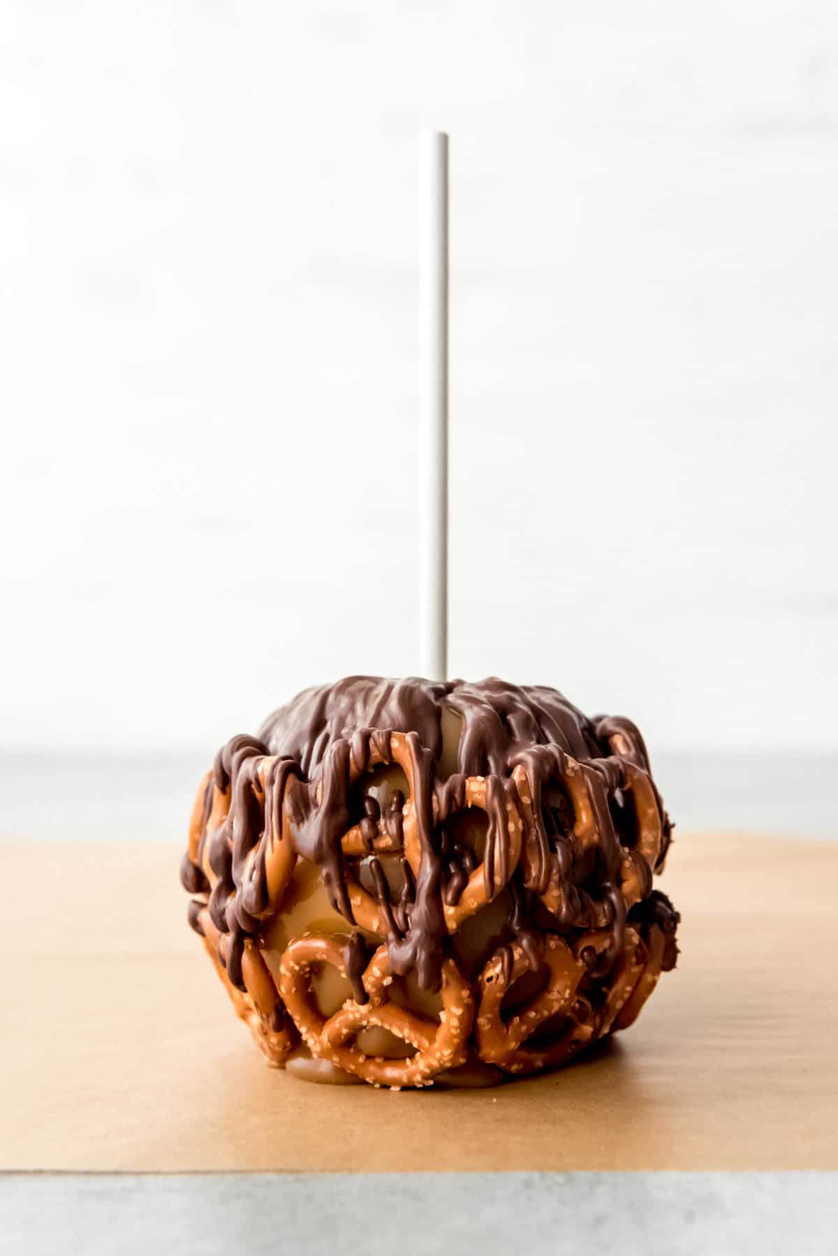An image of a chocolate pretzel caramel apple.
