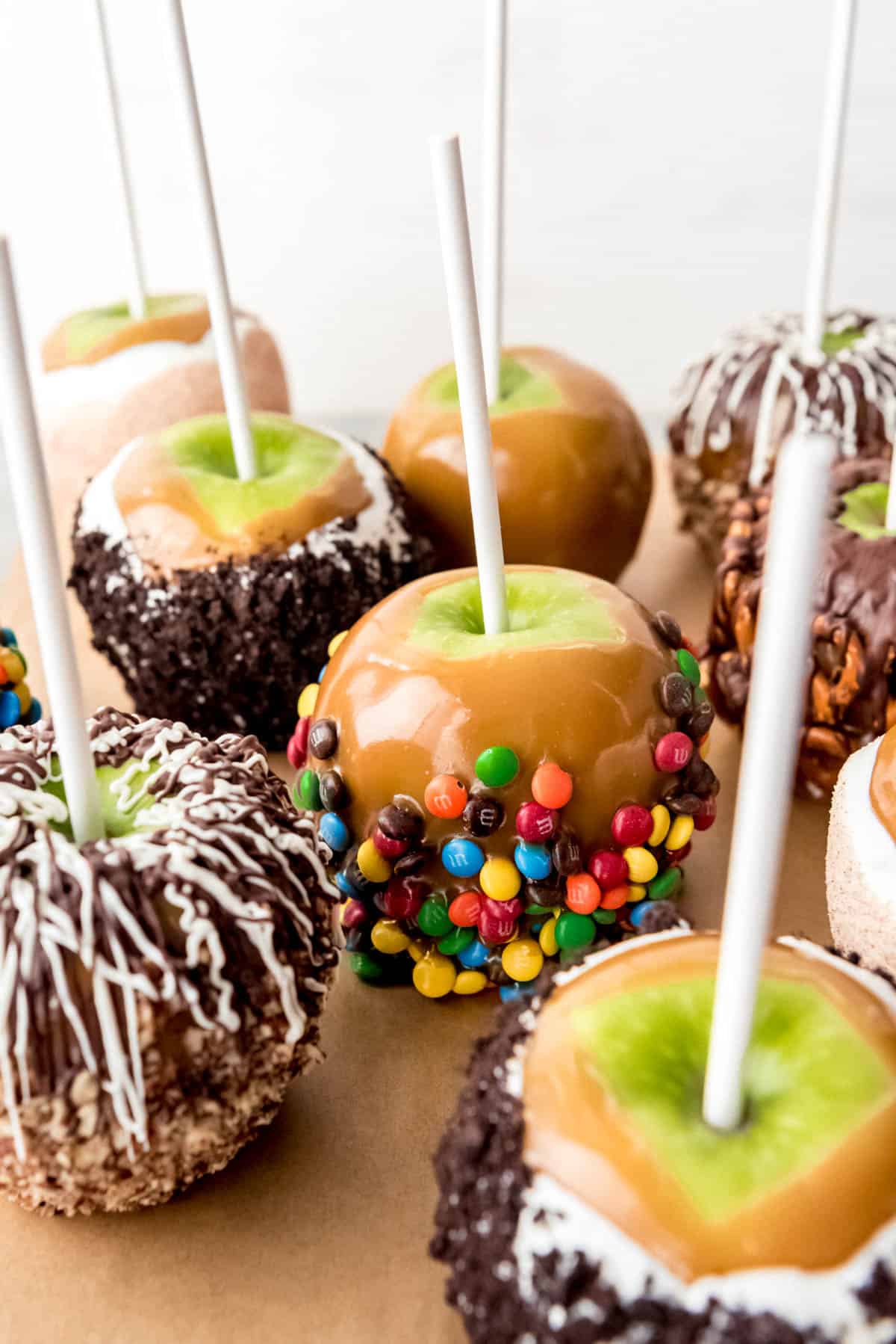 An image of different types of homemade caramel apples.