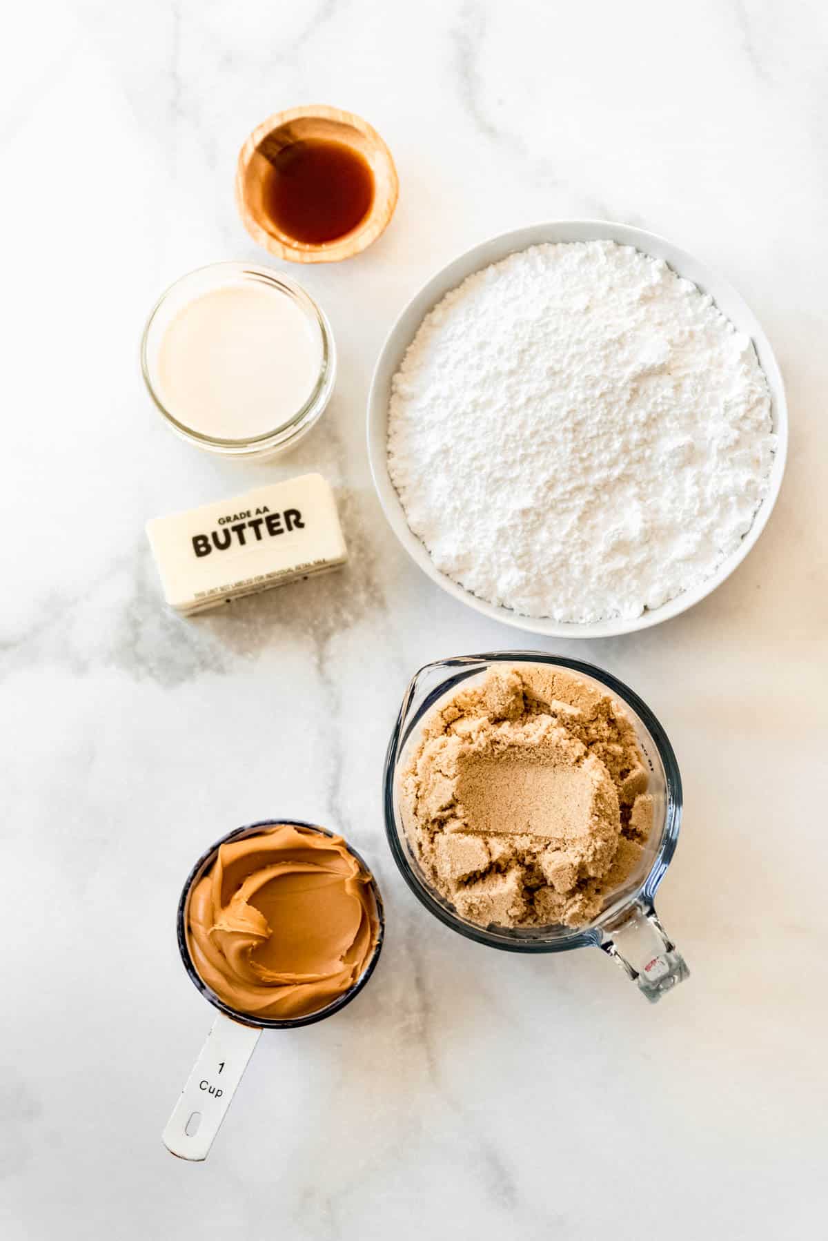 Top view of peanut butter fudge ingredients in small bowls. 