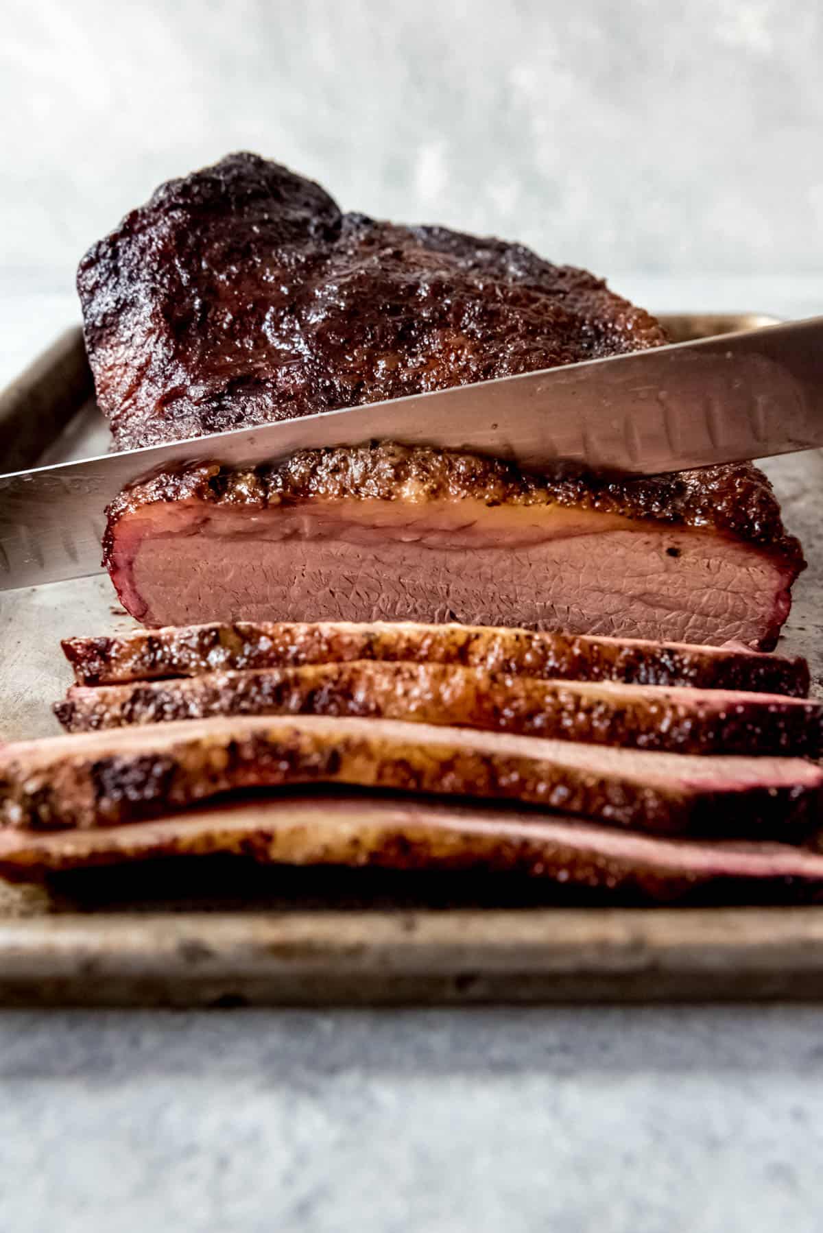 An image of a Texas smoked brisket being sliced.