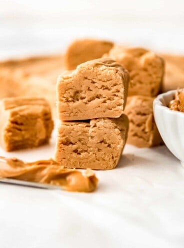Stacked squares of peanut butter fudge.