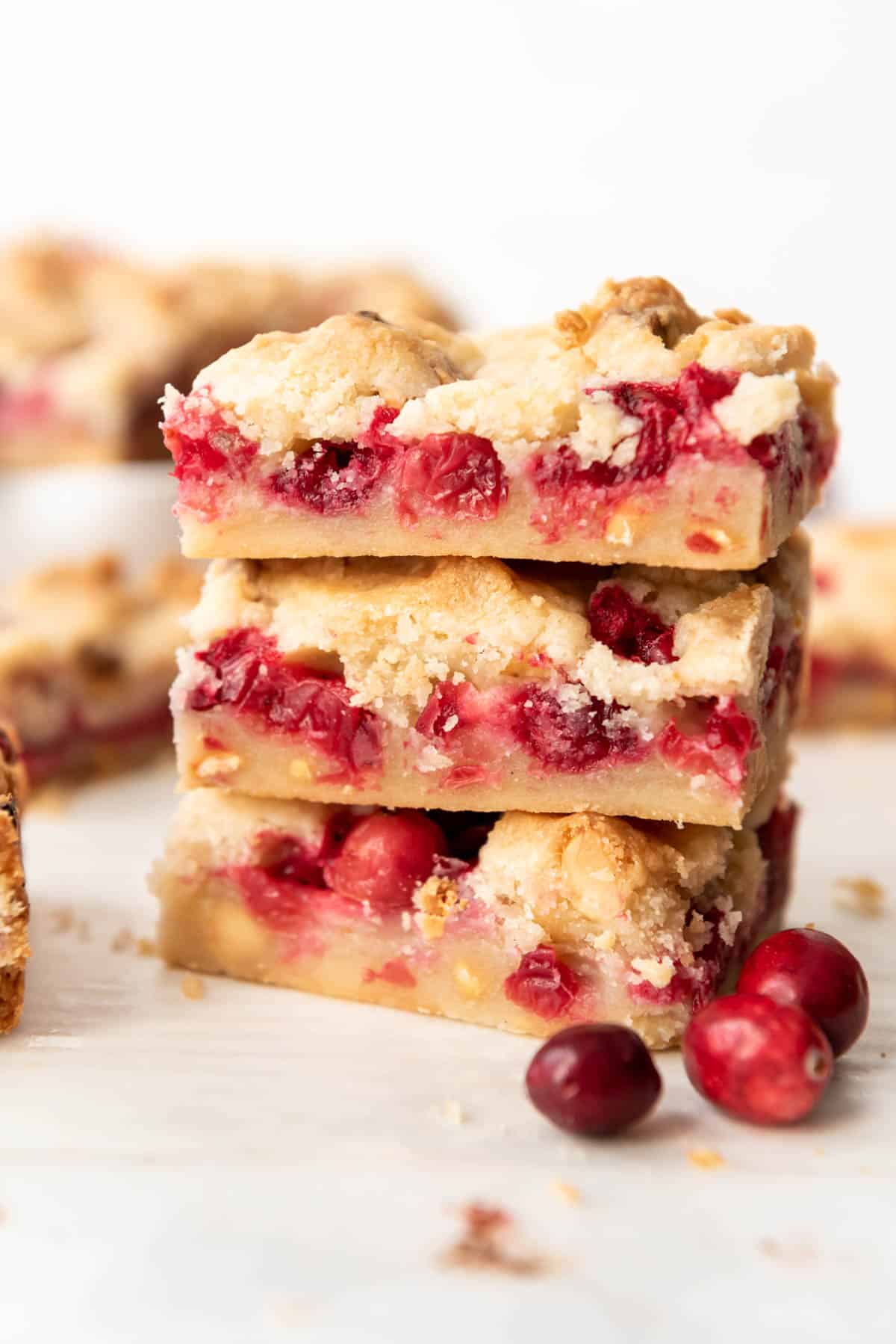 Stacked cranberry shortbread bars.