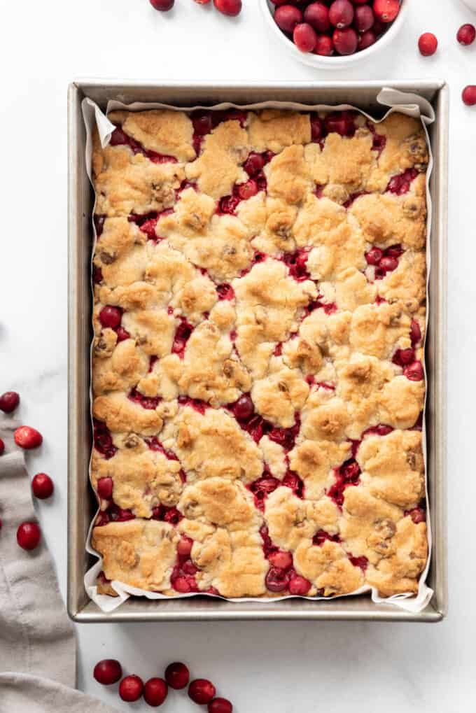 Baked cranberry shortbread bars in a pan.