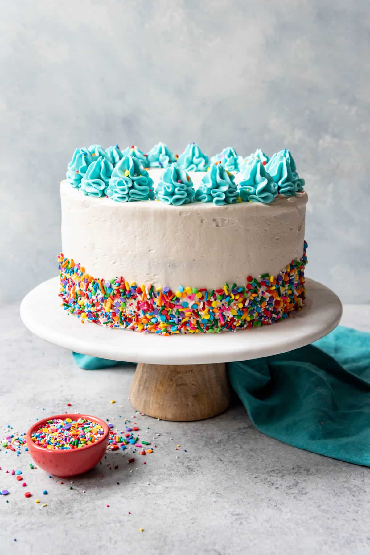 A frosted and decorated funfetti cake.